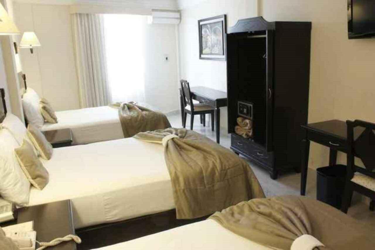 Hotel Victoria Mérida Exterior foto A room at the hotel